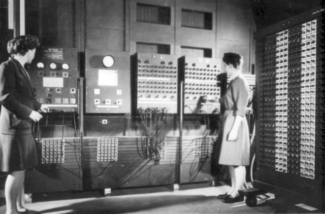 two women operating the ENIAC's main control panel